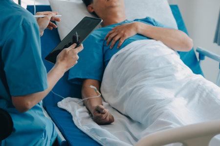 Injured patient showing doctor broken wrist and arm with bandage in hospital office or emergency room. Sprain, stress fracture or repetitive strain injury in hand. Nurse helping customer. First aid.の写真素材