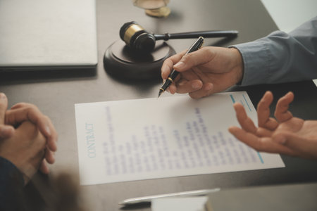 Lawyer, legal advisor, businessman brainstorming information on agreement details Business contracts in legal processing books for accuracy in contract documents. joint financial investment.の写真素材