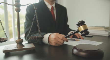 Lawyer, legal advisor, businessman brainstorming information on agreement details Business contracts in legal processing books for accuracy in contract documents. joint financial investment.の写真素材