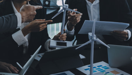 Close up of Business team analyzing income charts and graphs with modern laptop computer. Business...
