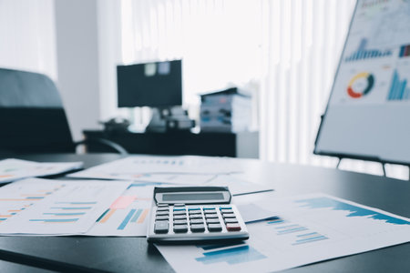 Shot of a asian young business Female working on laptop in her workstation.の写真素材