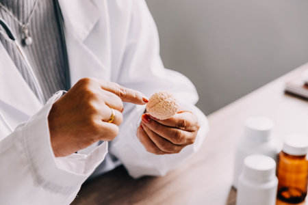 Female doctor holding virtual Lungs in hand. Handrawn human organ, copy space on right side, raw photo colors. Healthcare hospital service concept stock photoの写真素材