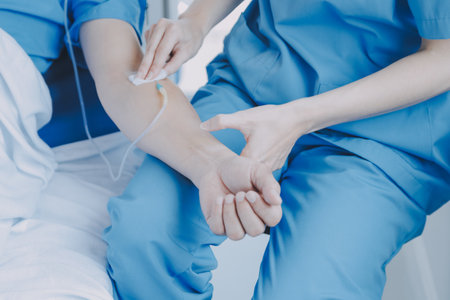 Injured patient showing doctor broken wrist and arm with bandage in hospital office or emergency...
