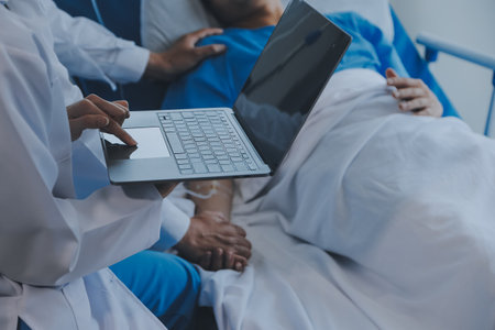 Injured patient showing doctor broken wrist and arm with bandage in hospital office or emergency room. Sprain, stress fracture or repetitive strain injury in hand. Nurse helping customer. First aid.の写真素材