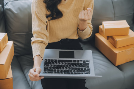 Business woman start up small business entrepreneur SME success .freelance woman working at home with Online Parcel delivery. SME and packaging deliveryconceptの写真素材