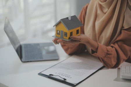 Real estate agent and customer signing contract to buy house, insurance or loan real estate.rent a house,get insurance or loan real estate or property.の写真素材