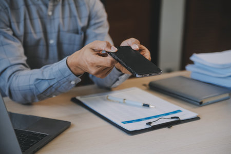 Business Financing Accounting Banking Concept, businesswoman doing finances and calculate about cost to real estate investment and in other, tax system.の写真素材