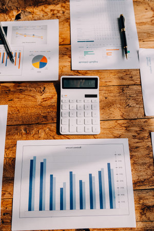 Brainstorming Collaboration and successful partnership analysis by Young business Asian people working in an office workspaceの写真素材