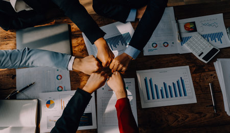 Brainstorming Collaboration and successful partnership analysis by Young business Asian people working in an office workspaceの写真素材