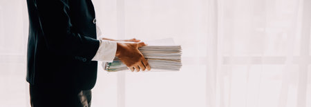 Businesswoman or accountant working Financial investment on calculator, calculate, analyze business and marketing growth on financial document data graph, Accounting, Economic, commercial concept.の写真素材