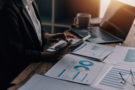 Businesswoman or accountant working Financial investment on calculator, calculate, analyze business...