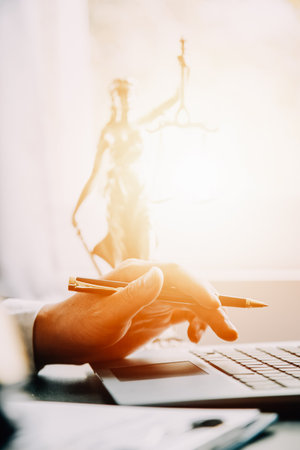 Judge gavel with Justice lawyers having team meeting at law firm background. Concepts of Law and Legal services.の写真素材