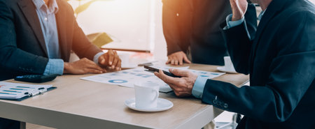 Entrepreneurs and business people conference in modern meeting room, happy multiracial coworkers have fun cooperating working together at office meeting, asian teamwork conceptの写真素材