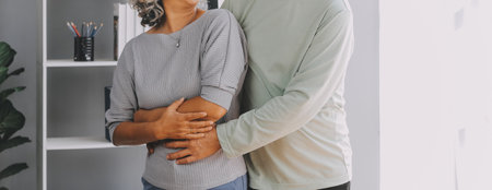 Happy mature couple using laptop at homeの写真素材