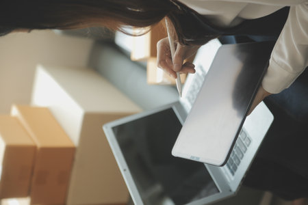 Business woman start up small business entrepreneur SME success .freelance woman working at home with Online Parcel delivery. SME and packaging deliveryconceptの写真素材