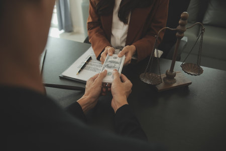 Business and lawyers discussing contract papers with brass scale on desk in office. Law, legal...