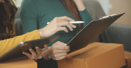 Business woman start up small business entrepreneur SME success .freelance woman working at home with Online Parcel delivery. SME and packaging deliveryconceptの写真素材