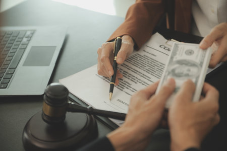 Business and lawyers discussing contract papers with brass scale on desk in office. Law, legal...