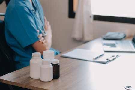 Asian doctor woman visited patient woman to diagnosis and check up health at home or private hospital. Female patient explain health problem and symptoms to doctor .Health care premium service at homeの写真素材