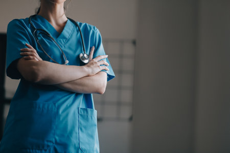 Asian doctor woman visited patient woman to diagnosis and check up health at home or private hospital. Female patient explain health problem and symptoms to doctor .Health care premium service at homeの写真素材
