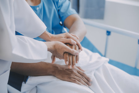 Doctor and patient discussing current health examination while sitting at the desk in clinic office, closeup. Medicine concept.の写真素材