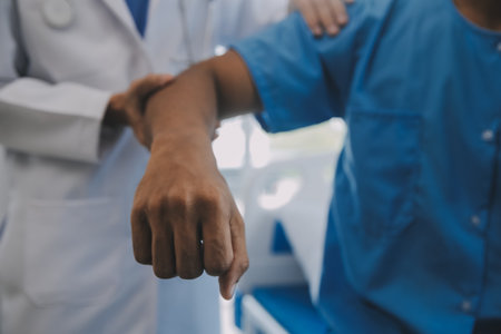 Doctor and patient discussing current health examination while sitting at the desk in clinic office, closeup. Medicine concept.の写真素材