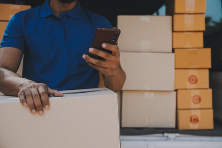 Business woman start up small business entrepreneur SME success .freelance woman working at home with Online Parcel delivery. SME and packaging deliveryconceptの写真素材