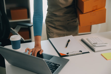 Business woman start up small business entrepreneur SME success .freelance woman working at home with Online Parcel delivery. SME and packaging deliveryconceptの写真素材