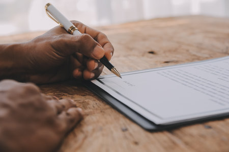 Close up view of job interview in office, focus on resume writing tips, employer reviewing good cv of prepared skilled applicant, recruiter considering application, hr manager making hiring decisionの写真素材