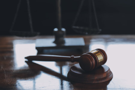 Justice and law concept.Male judge in a courtroom with the gavel, working with, computer and docking...