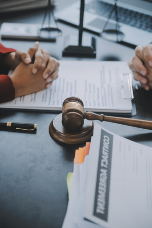 Justice and law concept.Male judge in a courtroom with the gavel, working with, computer and docking...