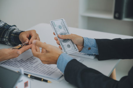 Real estate agent and customer signing contract to buy house, insurance or loan real estate.rent a house,get insurance or loan real estate or property.の写真素材