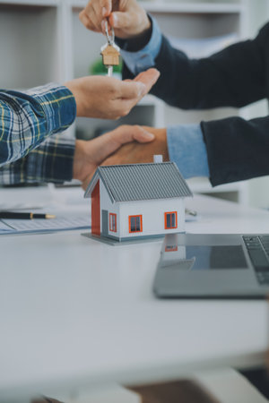 Real estate agent and customer signing contract to buy house, insurance or loan real estate.rent a house,get insurance or loan real estate or property.の写真素材