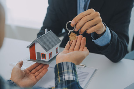 Real estate agent and customer signing contract to buy house, insurance or loan real estate.rent a house,get insurance or loan real estate or property.の写真素材