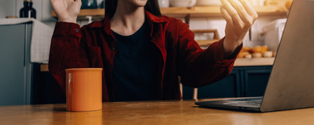 Portrait of Young Asian woman hand freelancer is working her job on computer tablet in modern office. Doing accounting analysis report real estate investment data, Financial and tax systems concept.の写真素材