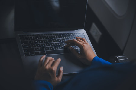 Using mobile and laptop, Thoughtful asian people female person onboard, airplane window, perfectly capture the anticipation and excitement of holiday travel. chinese, japanese people.の写真素材