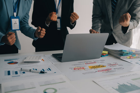 A group of businesspeople and investors meet to discuss market's success in past quarter. idea of...