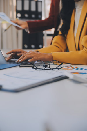 Co working conference, Business team meeting present, investor executive colleagues discussing new plan financial graph data on outdoors office table with laptop and tablet, Finance, accountingの写真素材