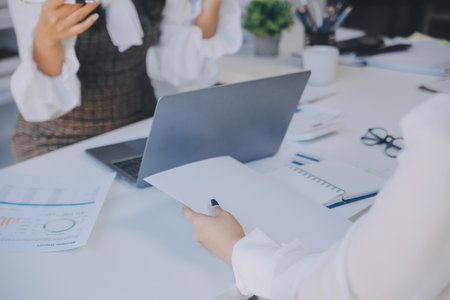 Business team collaboration discussing working analyzing with financial data and marketing growth report graph in team, presentation and brainstorming to strategy planning making profit of company.の写真素材