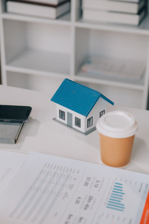 real estate agent Delivering sample homes to customers, mortgage loan contracts. Make a contract for hire purchase and sale of a house. and home insurance contracts, home mortgage loan conceptsの写真素材