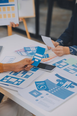 Close up ux developer and ui designer use augmented reality brainstorming about mobile app interface...
