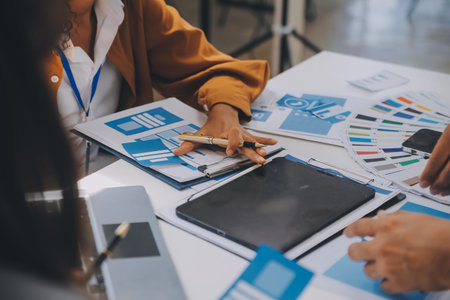 Close up ux developer and ui designer use augmented reality brainstorming about mobile app interface wireframe design on desk at modern office.Creative digital development agencyの写真素材