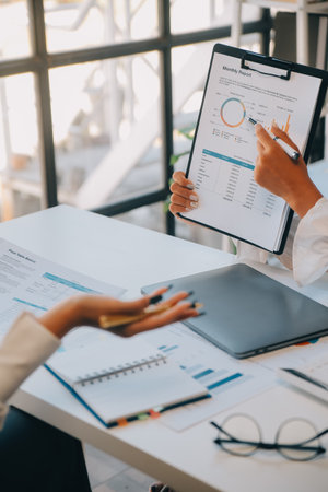 Business team collaboration discussing working analyzing with financial data and marketing growth report graph in team, presentation and brainstorming to strategy planning making profit of company.の写真素材
