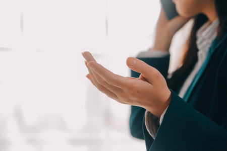 Thinking about how to take the business to technological heights. Cropped shot of an attractive young businesswoman working in her office.の写真素材