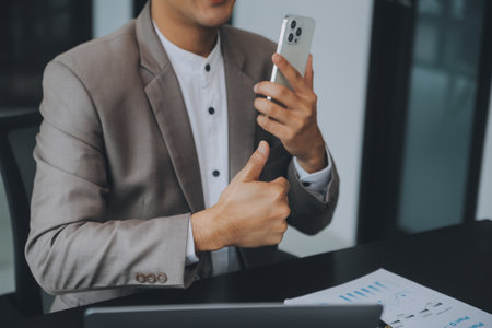 Audit concept,Administrator business man financial inspector and secretary making report calculating balance. Internal Revenue Service checking document.の写真素材