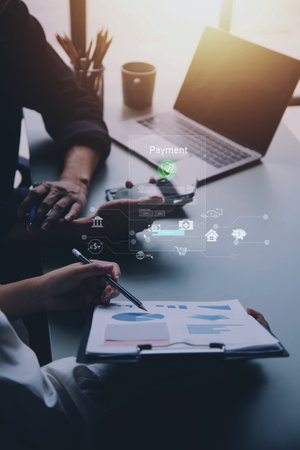Digital banking network, internet payment, financial technology or FinTech concept. Businessman using smartphone with icons on virtual screen, online shopping and payment via mobile banking appsの写真素材