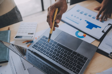 Finance manager meeting discussing company growth project success financial statistics, professional investor working start up project for strategy plan with document, laptop and digital tablet.の写真素材