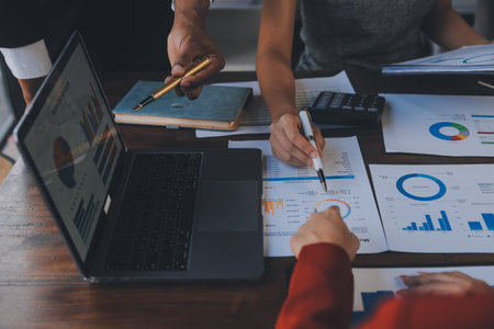 Finance manager meeting discussing company growth project success financial statistics, professional investor working start up project for strategy plan with document, laptop and digital tablet.の写真素材