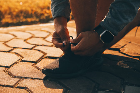 Athlete runner feet running on road, Jogging concept at outdoors. Man running for exercise.の写真素材