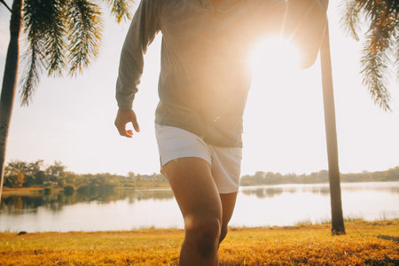 Athlete runner feet running on road, Jogging concept at outdoors. Man running for exercise.の写真素材